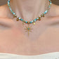 Celestial Tide – Turquoise-Tone Beaded Necklace with Gold-Tone Starburst Pendant